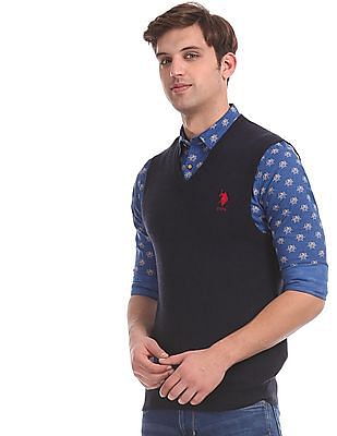 polo shirt and v neck sweater